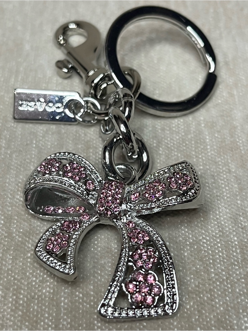 Coach Silver-Tone Pink Crystal Bow Key Ring Charm